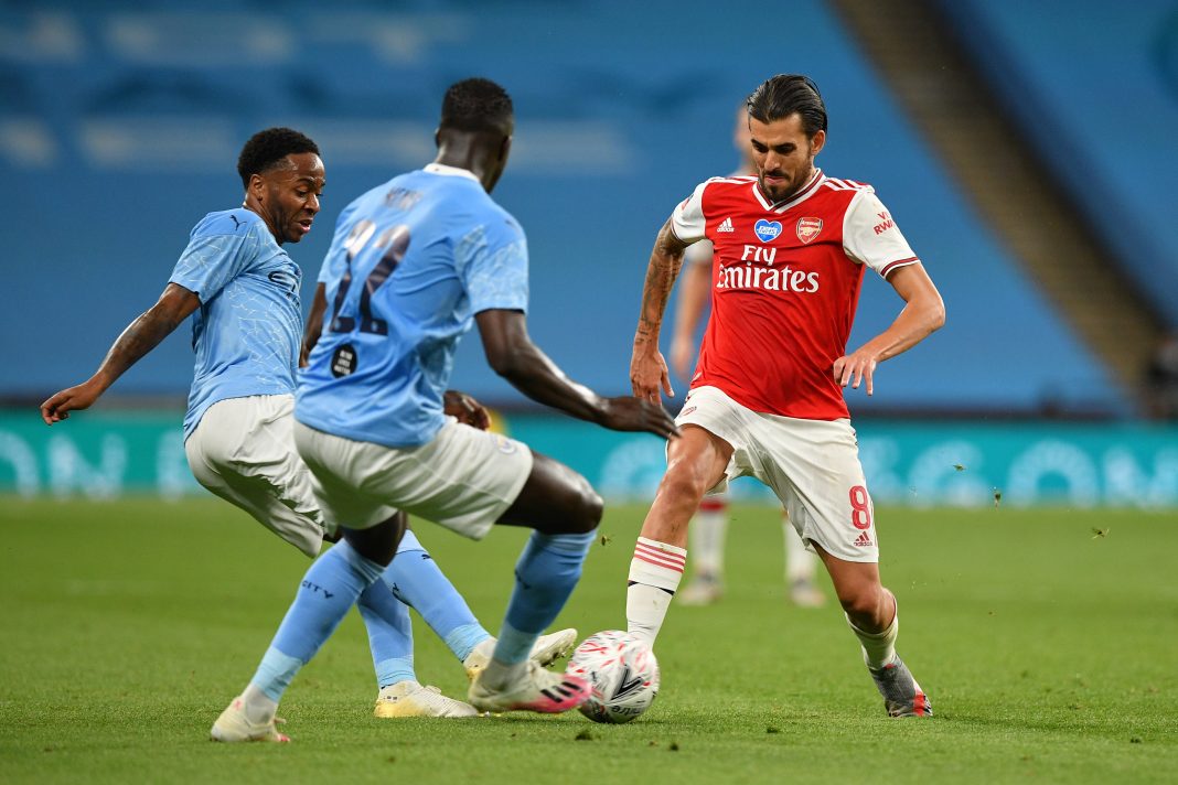 LONDON, ENGLAND - JULY 18: Dani Ceballos of Arsenal battles for possession with Raheem Sterling and Benjamin Mendy of Manchester City during the FA Cup Semi Final match between Arsenal and Manchester City at Wembley Stadium on July 18, 2020 in London, England. Football Stadiums around Europe remain empty due to the Coronavirus Pandemic as Government social distancing laws prohibit fans inside venues resulting in all fixtures being played behind closed doors. (Photo by Justin Tallis/Pool via Getty Images)