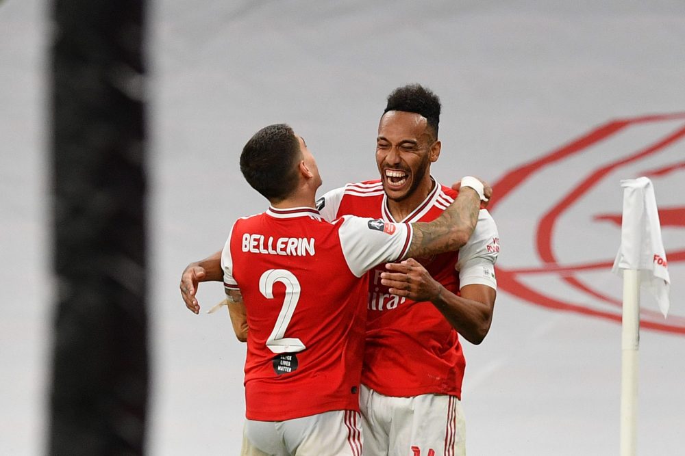 LONDON, ENGLAND - JULY 18: Pierre-Emerick Aubameyang of Arsenal celebrates with teammate Hector Bellerin after scoring his team's second goal during the FA Cup Semi Final match between Arsenal and Manchester City at Wembley Stadium on July 18, 2020 in London, England. Football Stadiums around Europe remain empty due to the Coronavirus Pandemic as Government social distancing laws prohibit fans inside venues resulting in all fixtures being played behind closed doors. (Photo by Justin Tallis/Pool via Getty Images)