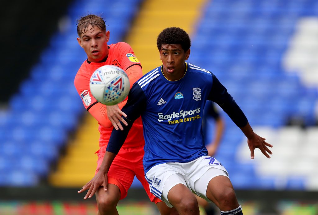 BIRMINGHAM, ENGLAND - JULY 01: Jude Bellingham of Birmingham City os challenged by Emile Smith Rowe of Huddersfield Town during the Sky Bet Championship match between Birmingham City and Huddersfield Town at St Andrew's Trillion Trophy Stadium on July 01, 2020 in Birmingham, England. (Photo by Catherine Ivill/Getty Images)