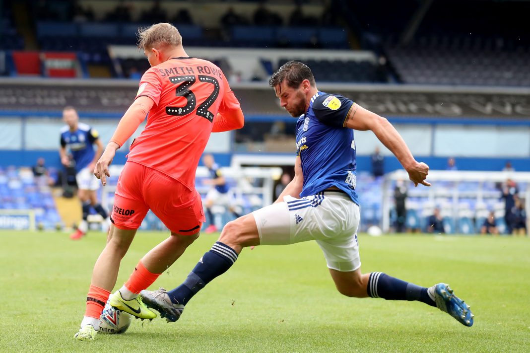 BIRMINGHAM, ENGLAND - JULY 01: Emile Smith Rowe of Huddersfield Town is challenged by Lukas Jutkiewicz of Birmingham City during the Sky Bet Championship match between Birmingham City and Huddersfield Town at St Andrew's Trillion Trophy Stadium on July 01, 2020 in Birmingham, England. (Photo by Catherine Ivill/Getty Images)