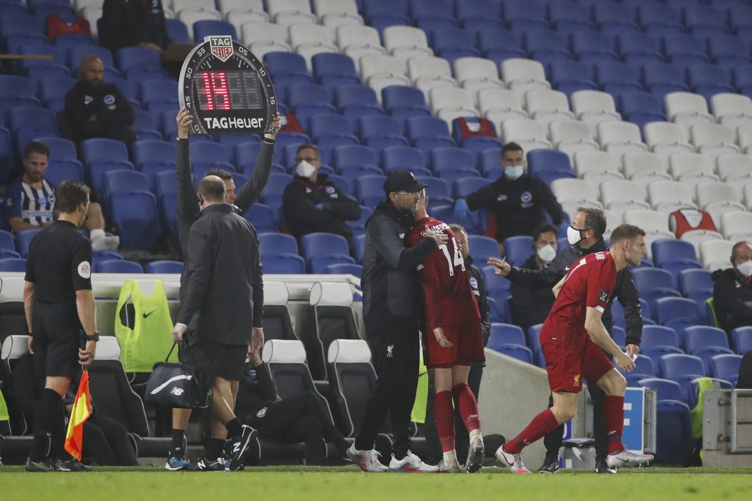 BRIGHTON, ENGLAND - JULY 08: Jurgen Klopp, Manager of Liverpool embraces Jordan Henderson of Liverpool after he comes off the pitch after sustaining an injury during the Premier League match between Brighton & Hove Albion and Liverpool FC at American Express Community Stadium on July 08, 2020 in Brighton, England. Football Stadiums around Europe remain empty due to the Coronavirus Pandemic as Government social distancing laws prohibit fans inside venues resulting in all fixtures being played behind closed doors. (Photo by Paul Childs/Pool via Getty Images)