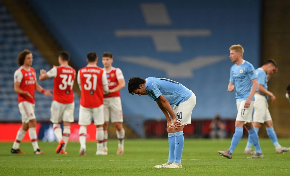 Manchester City's Spanish defender Eric García (C) reacts at the end of the English FA Cup semi-final football match between Arsenal and Manchester City at Wembley Stadium in London, on July 18, 2020. (Photo by JUSTIN TALLIS / POOL / AFP)