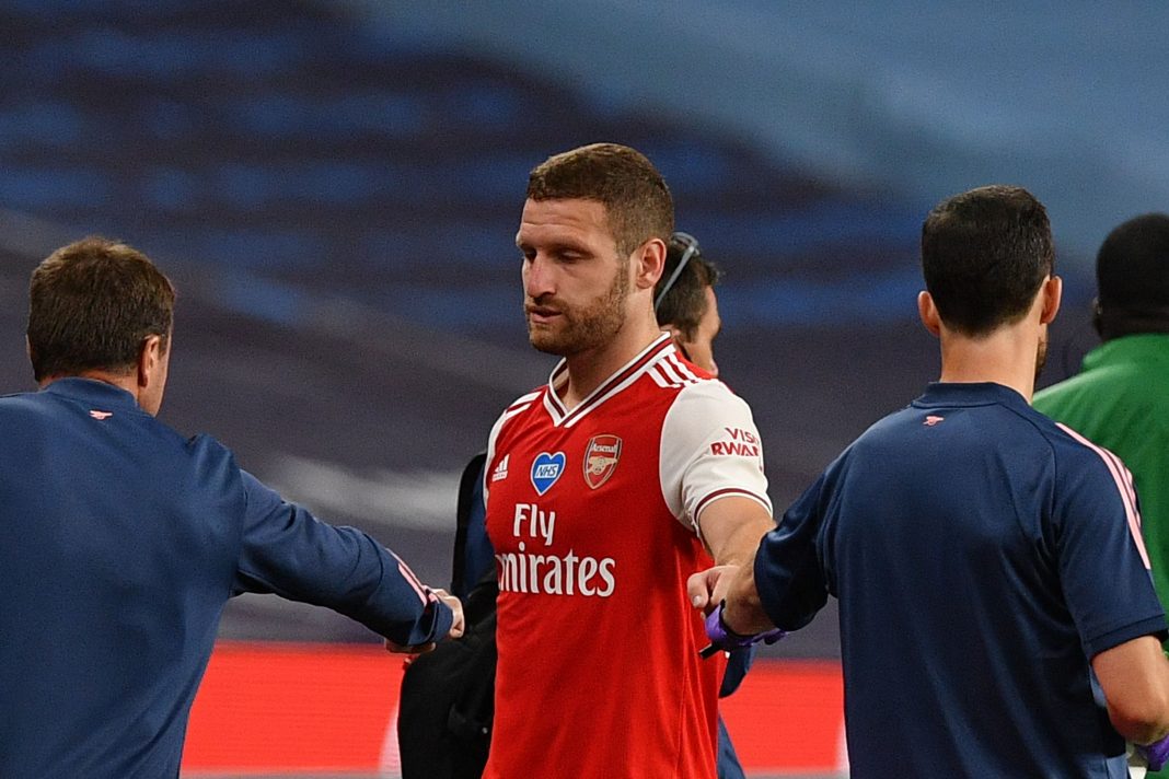 Arsenal's German defender Shkodran Mustafi (C) is helped off the pitch injured during the English FA Cup semi-final football match between Arsenal and Manchester City at Wembley Stadium in London, on July 18, 2020. (Photo by JUSTIN TALLIS / POOL / AFP) / NOT FOR MARKETING OR ADVERTISING USE / RESTRICTED TO EDITORIAL USE (Photo by JUSTIN TALLIS/POOL/AFP via Getty Images)