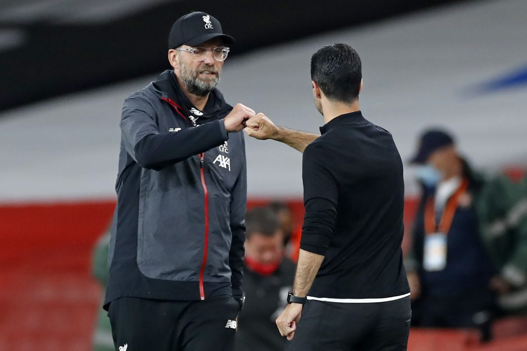 Liverpool's German manager Jurgen Klopp (L) and Arsenal's Spanish head coach Mikel Arteta gesture on the touchline after the English Premier League football match between Arsenal and Liverpool at the Emirates Stadium in London on July 15, 2020. - Arsenal won the game 2-1. (Photo by PAUL CHILDS / POOL / AFP)