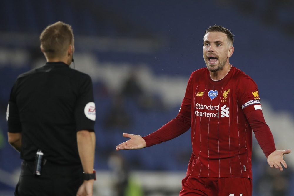 Liverpool's English midfielder Jordan Henderson argues with the referee during the English Premier League football match between Brighton and Hove Albion and Liverpool at the American Express Community Stadium in Brighton, southern England on July 8, 2020. (Photo by PAUL CHILDS / POOL / AFP) 