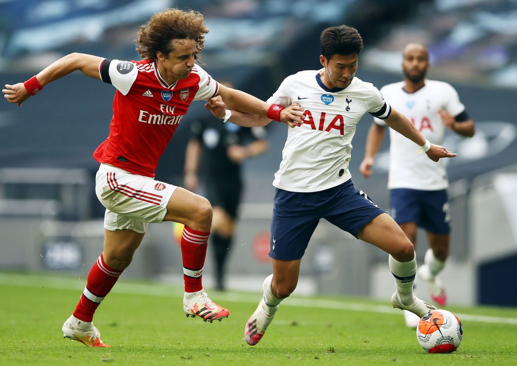 Tottenham Hotspur's South Korean striker Son Heung-Min (R) vies with Arsenal's Brazilian defender David Luiz during the English Premier League football match between Tottenham Hotspur and Arsenal at Tottenham Hotspur Stadium in London, on July 12, 2020. (Photo by Tim Goode / POOL / AFP) / RESTRICTED TO EDITORIAL USE. No use with unauthorized audio, video, data, fixture lists, club/league logos or 'live' services. Online in-match use limited to 120 images. An additional 40 images may be used in extra time. No video emulation. Social media in-match use limited to 120 images. An additional 40 images may be used in extra time. No use in betting publications, games or single club/league/player publications. /  (Photo by TIM GOODE/POOL/AFP via Getty Images)