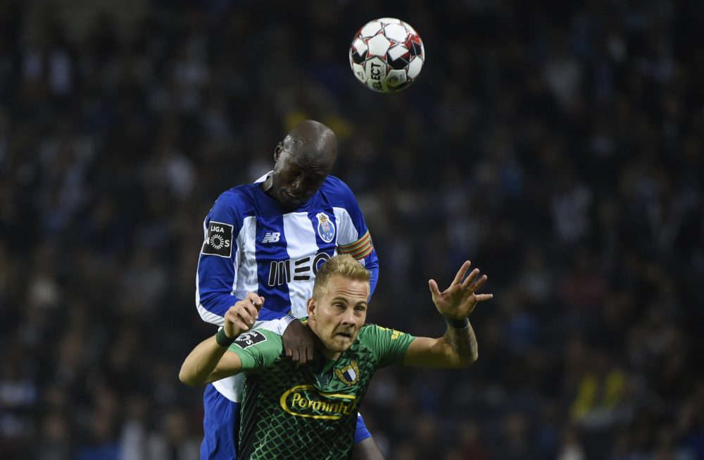 FC Porto's Portuguese midfielder Danilo Pereira (TOP) heads the ball over FC Famalicao's Serbian midfielder Uros Racic during the Portuguese league football match between FC Porto and FC Famalicao at the Dragao stadium in Porto on October 27, 2019. (Photo by MIGUEL RIOPA / AFP)