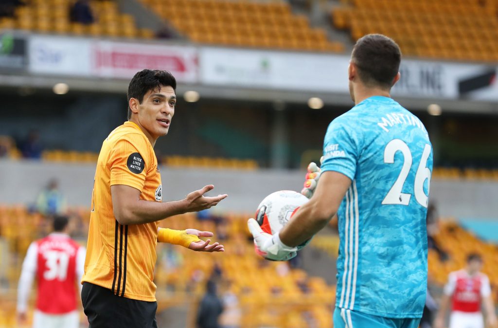 WOLVERHAMPTON, ENGLAND - JULY 04: Raul Jimenez speaks with Emiliano Martinez of Arsenal during the Premier League match between Wolverhampton Wanderers and Arsenal FC at Molineux on July 04, 2020 in Wolverhampton, England. Football Stadiums around Europe remain empty due to the Coronavirus Pandemic as Government social distancing laws prohibit fans inside venues resulting in all fixtures being played behind closed doors. (Photo by Catherine Ivill/Getty Images)