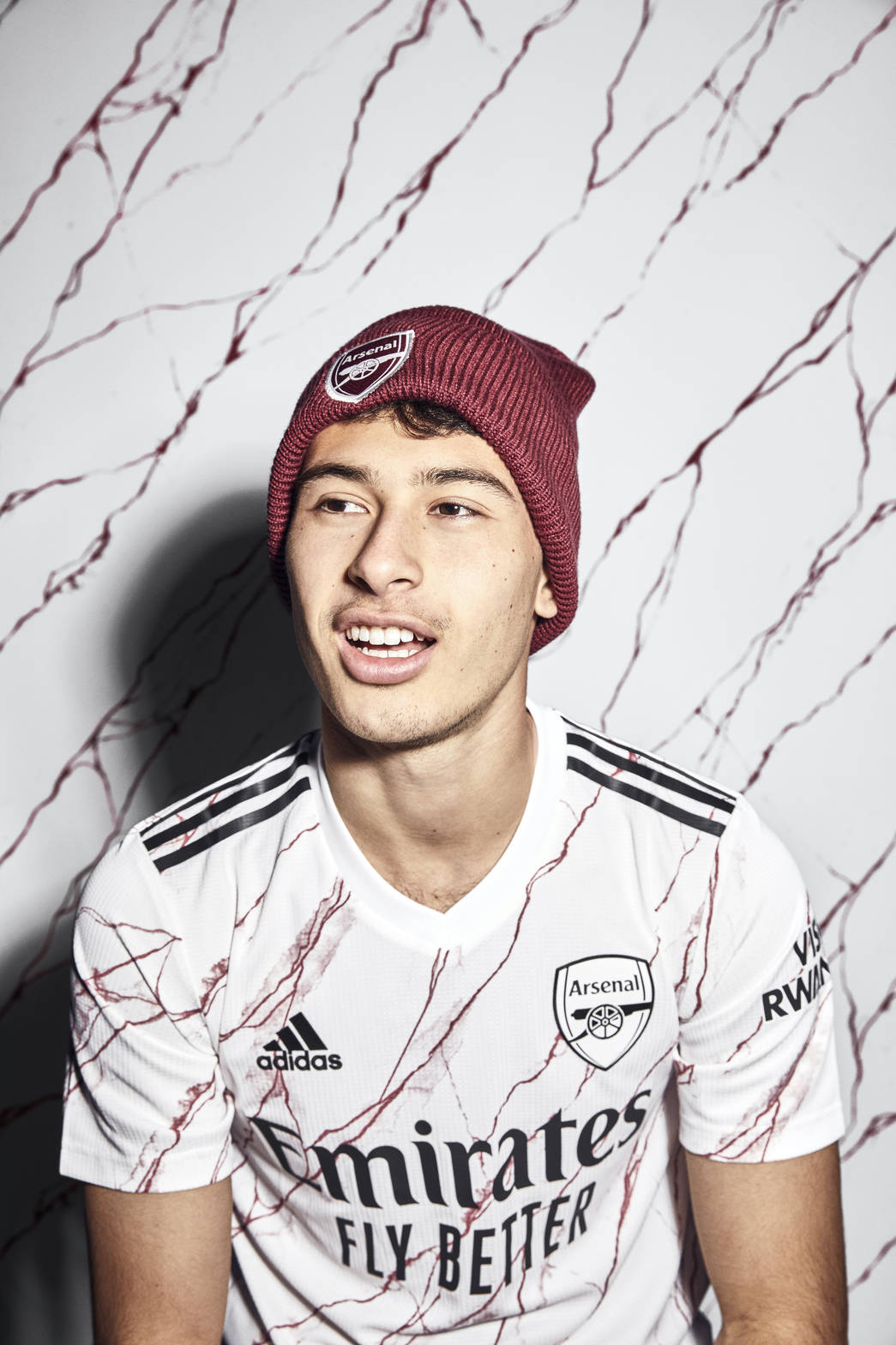Gabriel Martinelli poses in Arsenal's new Adidas away shirt