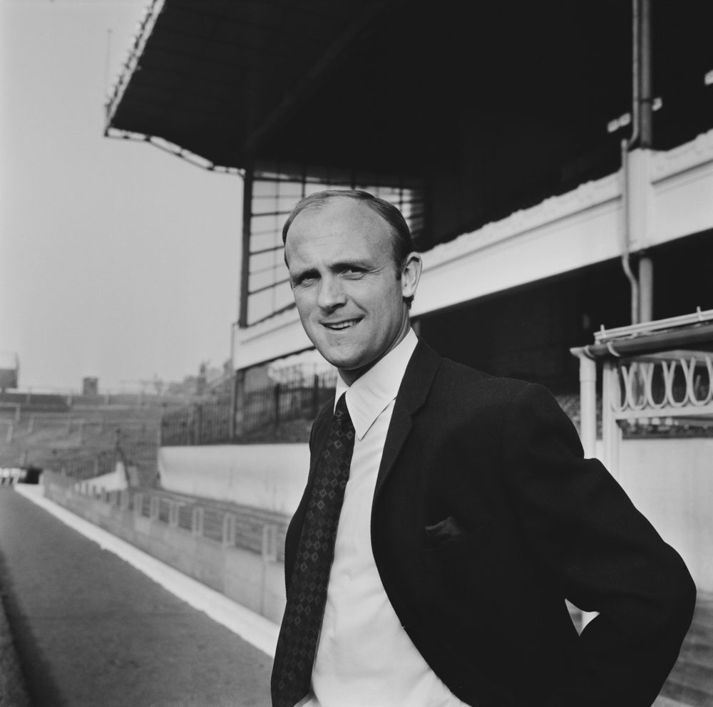 English former footballer and team coach of Arsenal Football Club, Don Howe (1935-2015) pictured standing beside the pitch at the club's Highbury Stadium in North London on 14th December 1970. (Photo by Dove/Daily Express/Hulton Archive/Getty Images)