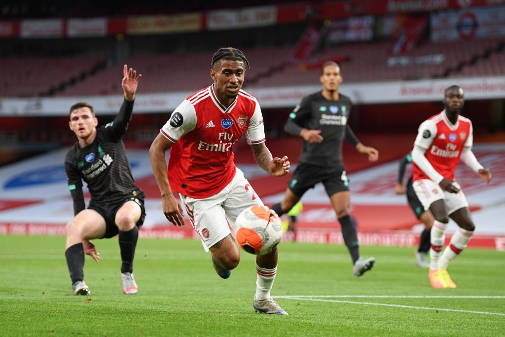 LONDON, ENGLAND - JULY 15: Reiss Nelson of Arsenal in action during the Premier League match between Arsenal FC and Liverpool FC at Emirates Stadium on July 15, 2020 in London, England. Football Stadiums around Europe remain empty due to the Coronavirus Pandemic as Government social distancing laws prohibit fans inside venues resulting in all fixtures being played behind closed doors. (Photo by Shaun Botterill/Getty Images)