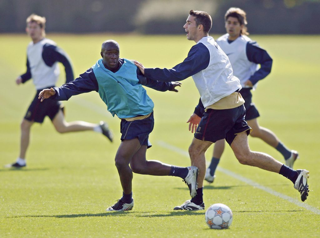 Arsenal footballers Lassana Diarra (L) and Robin Van Persie (R) attend a team training session at London Colney, in north London, 18 September 2007. Arsenal will challenge Spanish team Sevilla in the Champions League in London, 19 September 2007. AFP PHOTO/GLYN KIRK