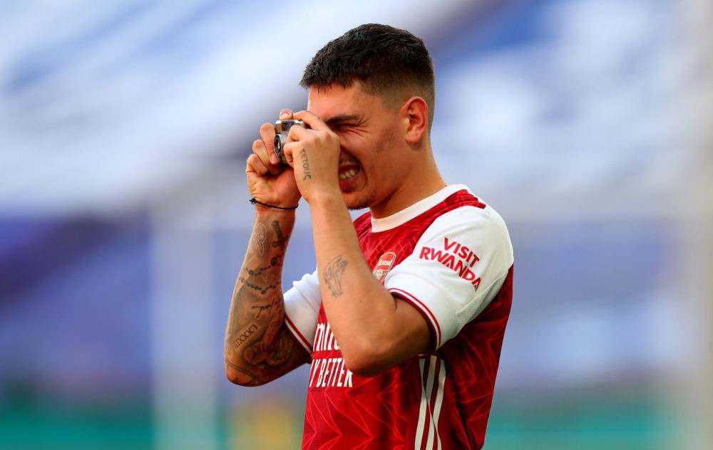 LONDON, ENGLAND - AUGUST 01: Hector Bellerin of Arsenal takes photos on his camera after his teams victory in the Heads Up FA Cup Final match between Arsenal and Chelsea at Wembley Stadium on August 01, 2020 in London, England. Football Stadiums around Europe remain empty due to the Coronavirus Pandemic as Government social distancing laws prohibit fans inside venues resulting in all fixtures being played behind closed doors. (Photo by Catherine Ivill/Getty Images)