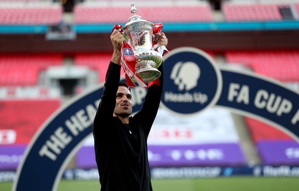 LONDON, ENGLAND - AUGUST 01: Mikel Arteta, Manager of Arsenal lifts the FA Cup Trophy after his teams victory in the Heads Up FA Cup Final match between Arsenal and Chelsea at Wembley Stadium on August 01, 2020 in London, England. Football Stadiums around Europe remain empty due to the Coronavirus Pandemic as Government social distancing laws prohibit fans inside venues resulting in all fixtures being played behind closed doors. (Photo by Catherine Ivill/Getty Images)