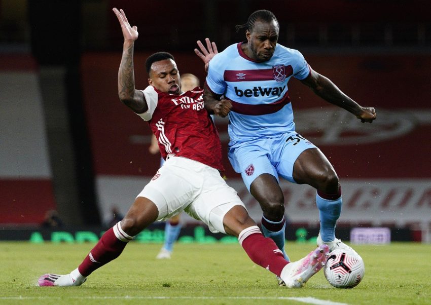 LONDON, ENGLAND - SEPTEMBER 19: Gabriel of Arsenal tackles Michail Antonio of West Ham United during the Premier League match between Arsenal and West Ham United at Emirates Stadium on September 19, 2020 in London, England. (Photo by Will Oliver - Pool/Getty Images)