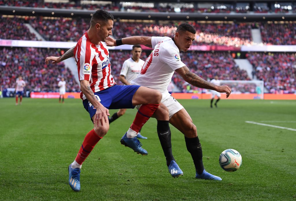 MADRID, SPAIN - MARCH 07: Vitolo of Atletico Madrid battles for possession with Diego Carlos of Sevilla FC during the Liga match between Club Atletico de Madrid and Sevilla FC at Wanda Metropolitano on March 07, 2020 in Madrid, Spain. (Photo by Denis Doyle/Getty Images)