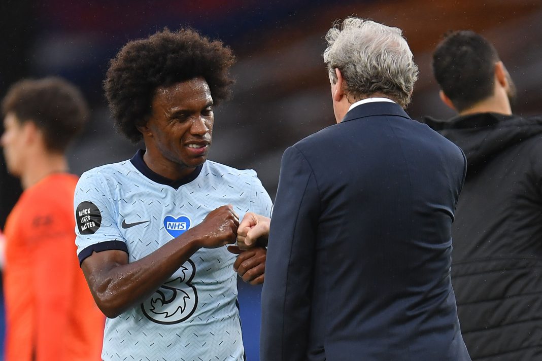 Chelsea's Brazilian midfielder Willian (L) bumps fists with Crystal Palace's English manager Roy Hodgson (R) at the end of the English Premier League football match between Crystal Palace and Chelsea at Selhurst Park in south London on July 7, 2020. (Photo by Justin Setterfield / POOL / AFP) / RESTRICTED TO EDITORIAL USE. No use with unauthorized audio, video, data, fixture lists, club/league logos or 'live' services. Online in-match use limited to 120 images. An additional 40 images may be used in extra time. No video emulation. Social media in-match use limited to 120 images. An additional 40 images may be used in extra time. No use in betting publications, games or single club/league/player publications. / (Photo by JUSTIN SETTERFIELD/POOL/AFP via Getty Images)