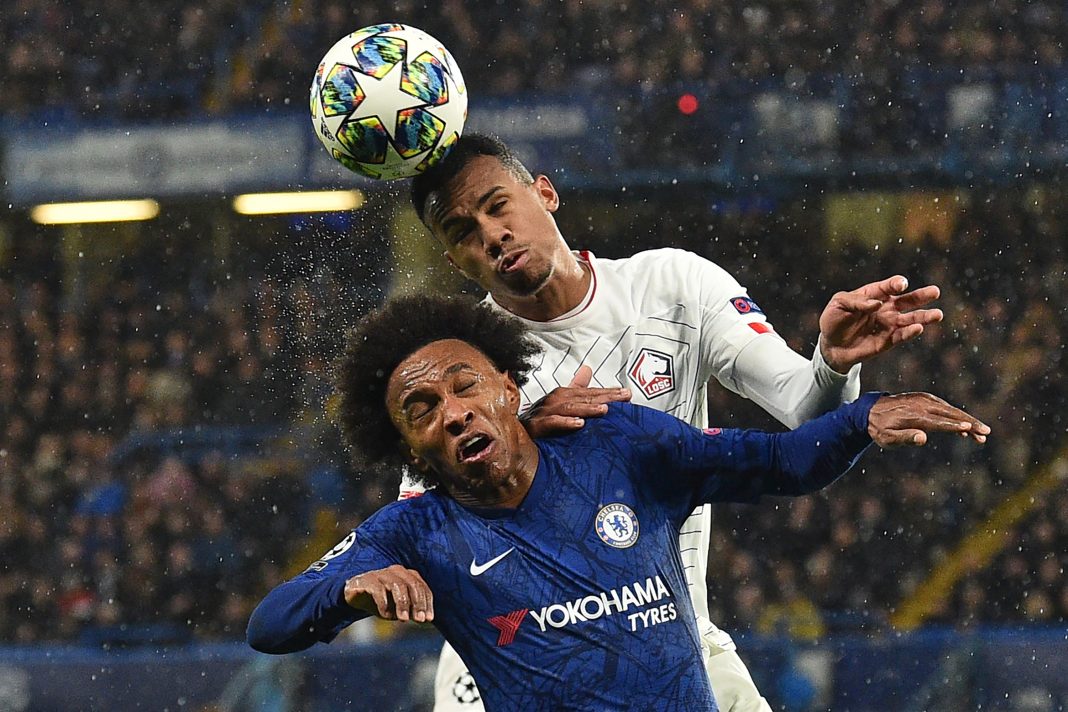 Future Arsenal teammates? Chelsea's Brazilian midfielder Willian (L) vies with Lille's Brazilian defender Gabriel dos Santos Magalhaes during the UEFA Champion's League Group H football match between Chelsea and Lille at Stamford Bridge in London on December 10, 2019. (Photo by Glyn KIRK / AFP)