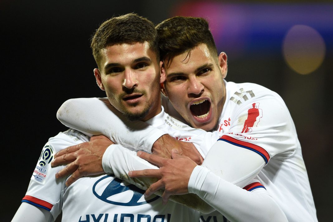 Lyon's French midfielder Houssem Aouar (L) celebrates after scoring a goal during the French L1 football match between Metz (FC Metz) and Lyon (OL) at Saint Symphorien stadium in Longeville-lès-Metz, eastern France, on February 21, 2020. (Photo by JEAN-CHRISTOPHE VERHAEGEN / AFP)