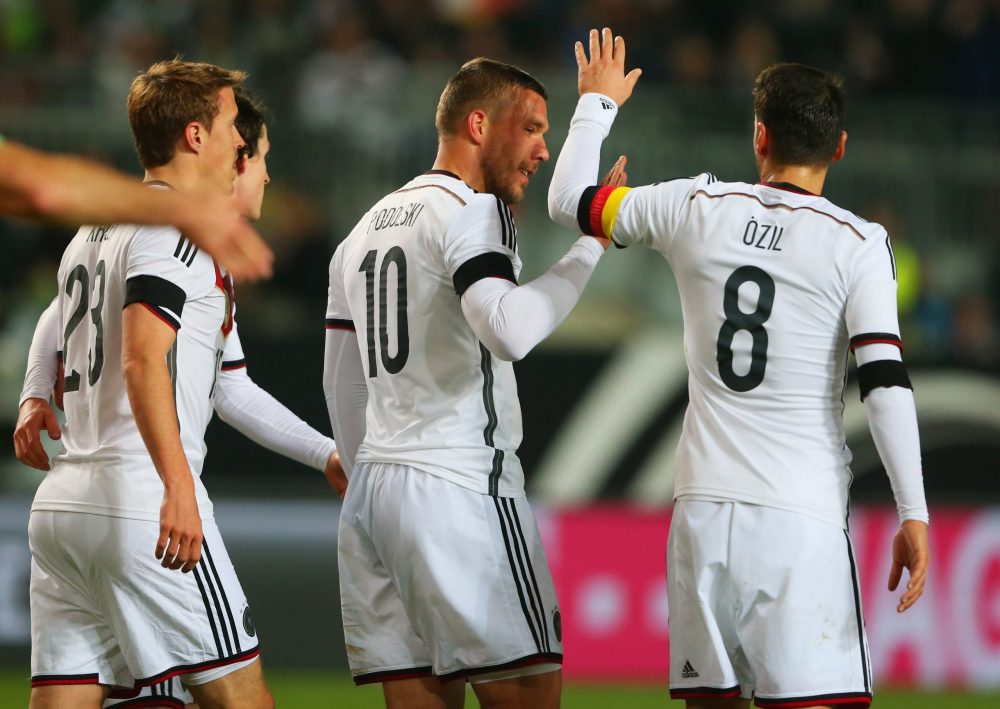 KAISERSLAUTERN, GERMANY - MARCH 25: Lukas Podolski of Germany (10) celebrates with Mesut Oezil (8) as he scores their second goal during the international friendly match between Germany and Australia at Fritz-Walter-Stadion on March 25, 2015 in Kaiserslautern, Germany. (Photo by Alexander Hassenstein/Bongarts/Getty Images)