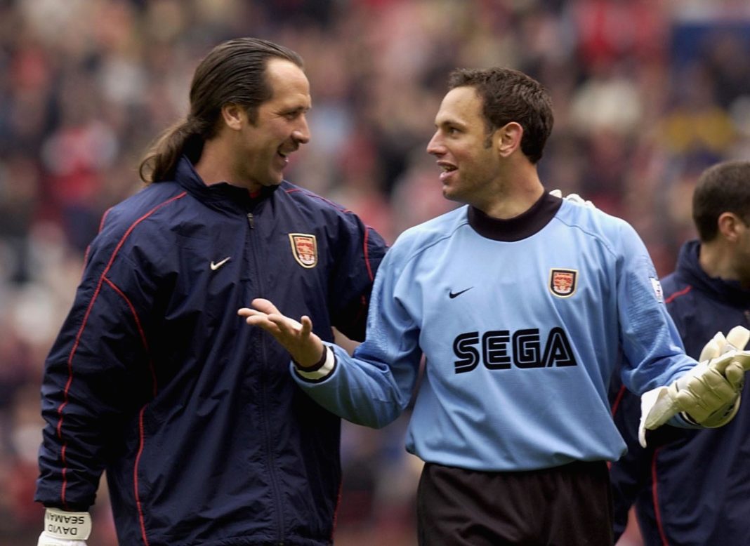 14 Apr 2002: David Seaman and Richard Wright of Arsenal leave the field after the AXA FA Cup Semi Final between Arsenal and Middlesbrough at Old Trafford, Manchester. DIGITAL IMAGE. Mandatory Credit: Ross Kinnaird/Getty Images