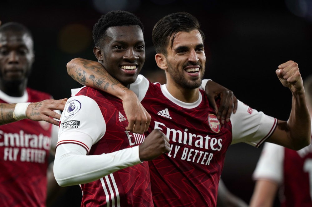 LONDON, ENGLAND - SEPTEMBER 19: Eddie Nketiah of Arsenal celebrates with teammate Dani Ceballos after scoring his team's second goal during the Premier League match between Arsenal and West Ham United at Emirates Stadium on September 19, 2020 in London, England. (Photo by Will Oliver - Pool/Getty Images)