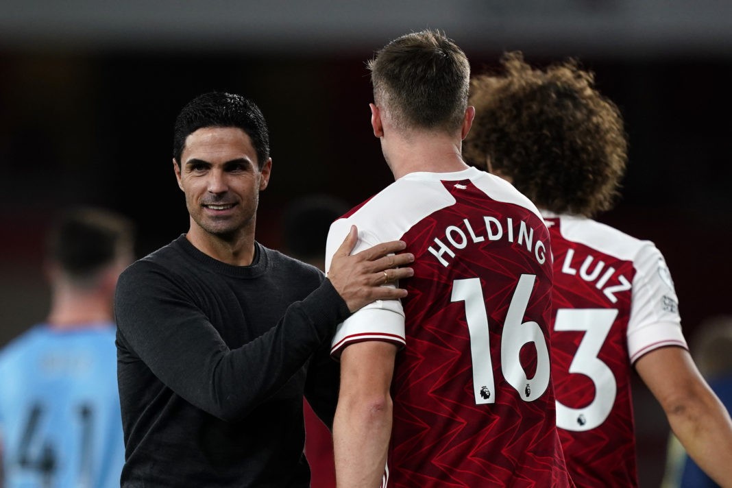 LONDON, ENGLAND - SEPTEMBER 19: Mikel Arteta, Manager of Arsenal speaks with Rob Holding of Arsenal following the Premier League match between Arsenal and West Ham United at Emirates Stadium on September 19, 2020 in London, England. (Photo by Will Oliver - Pool/Getty Images)