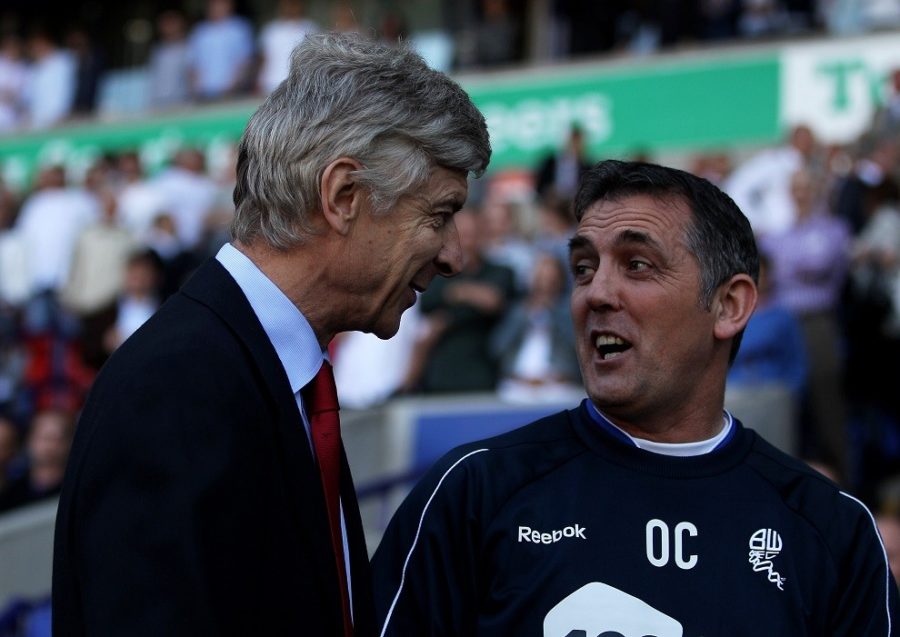 BOLTON, ENGLAND - APRIL 24: Arsenal Manager Arsene Wenger chats with Bolton Wanderers Manager Owen Coyle (R) prior to the Barclays Premier League match between Bolton Wanderers and Arsenal at the Reebok Stadium on April 24, 2011 in Bolton, England. (Photo by Michael Steele/Getty Images)