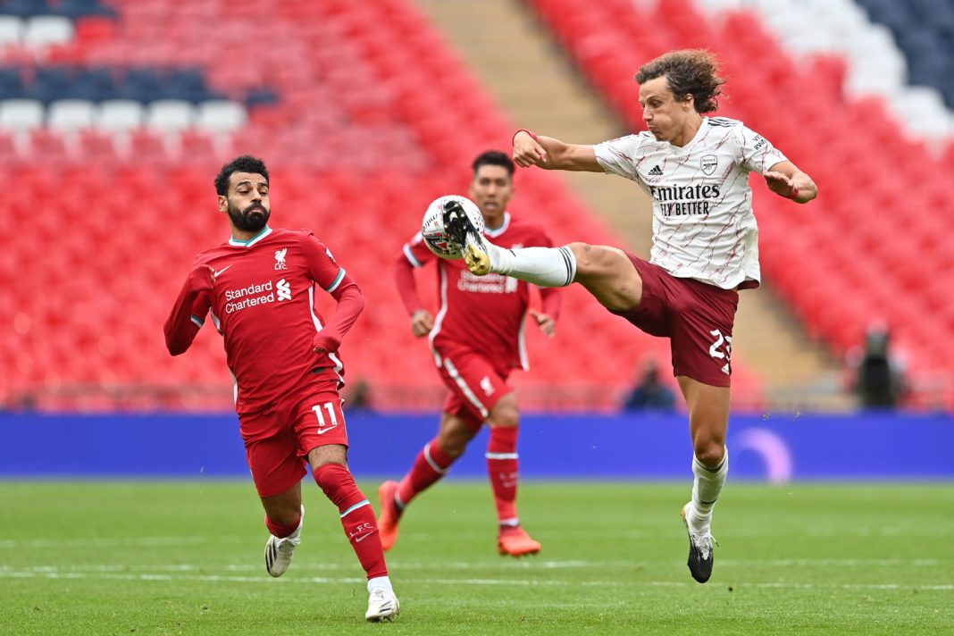 Arsenal's Brazilian defender David Luiz (R) jumps to control the ball in front of Liverpool's Egyptian midfielder Mohamed Salah (L) during the English FA Community Shield football match between Arsenal and Liverpool at Wembley Stadium in north London on August 29, 2020. (Photo by JUSTIN TALLIS/POOL/AFP via Getty Images)