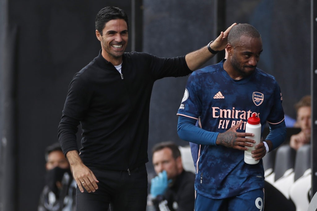 Arsenal's Spanish first-team manager Mikel Arteta (L) congratulates Arsenal's French striker Alexandre Lacazette (R) after the latter was substituted during the English Premier League football match between Fulham and Arsenal at Craven Cottage in London on September 12, 2020. (Photo by PAUL CHILDS / POOL / AFP)