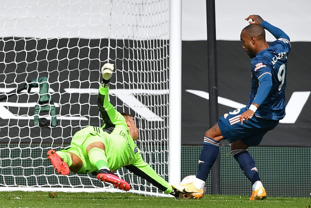 Arsenal's French striker Alexandre Lacazette (R) scores the opening goal during the English Premier League football match between Fulham and Arsenal at Craven Cottage in London on September 12, 2020. (Photo by Ben STANSALL / POOL / AFP)