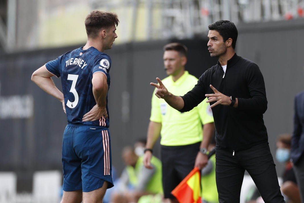 Arsenal's Spanish first-team manager Mikel Arteta (R) talks with Arsenal's Scottish defender Kieran Tierney (L) on the touchline during the English Premier League football match between Fulham and Arsenal at Craven Cottage in London on September 12, 2020. (Photo by PAUL CHILDS / POOL / AFP)