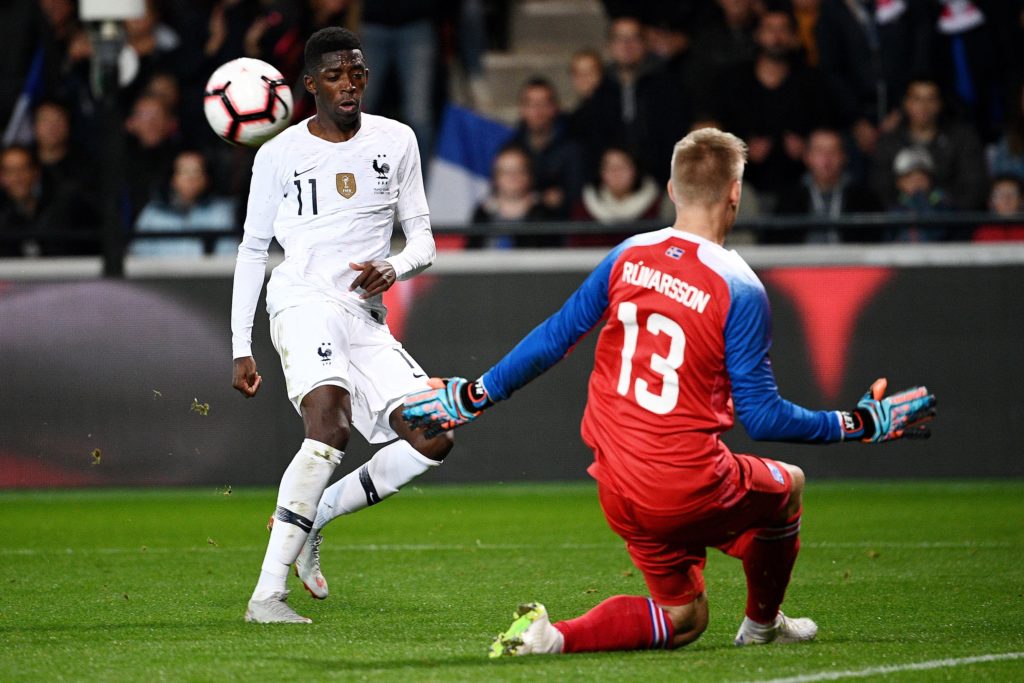 France's forward Ousmane Dembele (L) vies with Iceland's goalkeeper Runar Alex Runarsson during the friendly football match between France and Iceland at the Roudourou Stadium in Guingamp, western France on October 11, 2018. (Photo by FRANCK FIFE / AFP)
