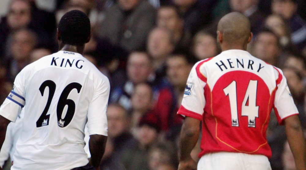 LONDON, UNITED KINGDOM: Ledley King (L) of Tottenham follows Arsenal's Thierry Henry (R) across the field during their Premiership match at White Hart Lane in London 13 November 2004. Both players scored in the game with Arsenal winning the match 5-4. AFP PHOTO Adrian DENNIS