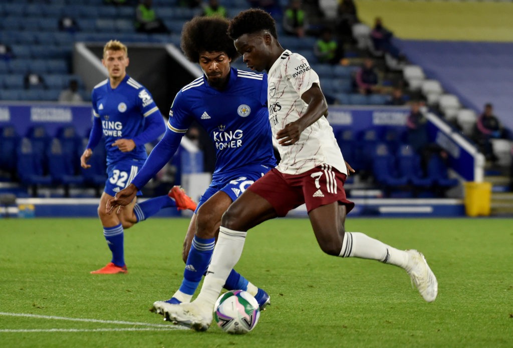 LEICESTER, ENGLAND - SEPTEMBER 23: Bukayo Saka of Arsenal battles for possession with Hamza Choudhury of Leicester City during the Carabao Cup third round match between Leicester City and Arsenal at The King Power Stadium on September 23, 2020 in Leicester, England. (Photo by Rui Vieira - Pool/Getty Images)