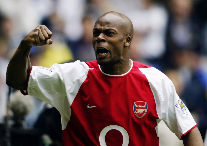 BOLTON - APRIL 26: Sylvain Wiltord of Arsenal celebrates after scoring the first goal during the FA Barclaycard Premiership match between Bolton Wanderers and Arsenal held on April 26, 2003 at the Reebok Stadium in Bolton, England. The match ended in a 2-2 draw. (Photo by Gary M. Prior/Getty Images)