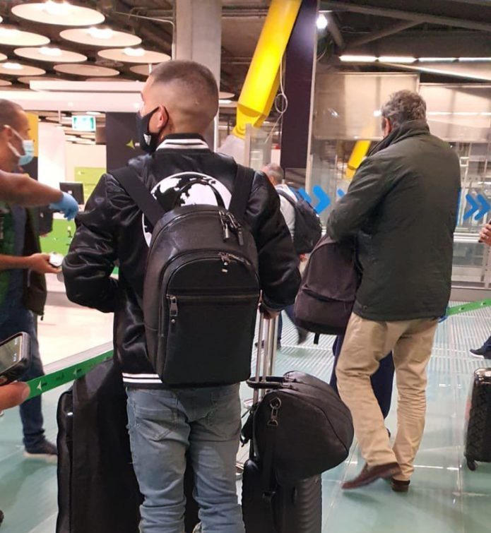 Lucas Torreira arrives at the airport
