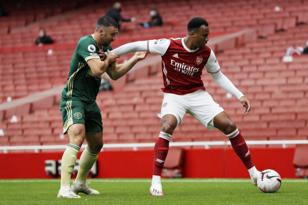 LONDON, ENGLAND - OCTOBER 04: Gabriel of Arsenal holds off Enda Stevens of Sheffield United during the Premier League match between Arsenal and Sheffield United at Emirates Stadium on October 04, 2020 in London, England. (Photo by Kirsty Wigglesworth - Pool/Getty Images)