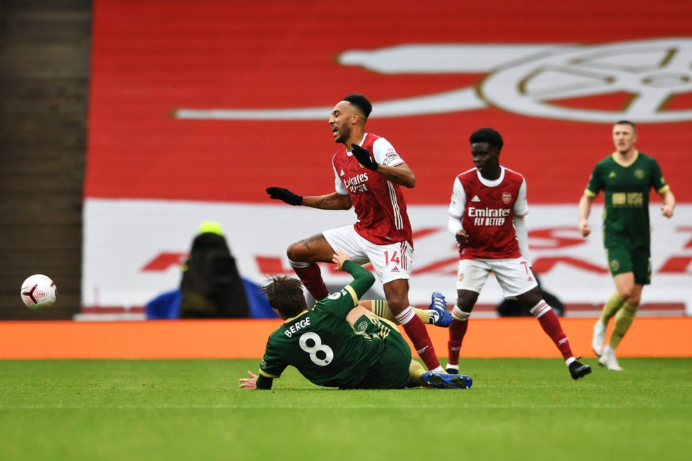 LONDON, ENGLAND - OCTOBER 04: Pierre-Emerick Aubameyang of Arsenal is challenged by Sander Berge of Sheffield United during the Premier League match between Arsenal and Sheffield United at Emirates Stadium on October 04, 2020 in London, England. Sporting stadiums around the UK remain under strict restrictions due to the Coronavirus Pandemic as Government social distancing laws prohibit fans inside venues resulting in games being played behind closed doors. (Photo by Neil Hall - Pool/Getty Images)