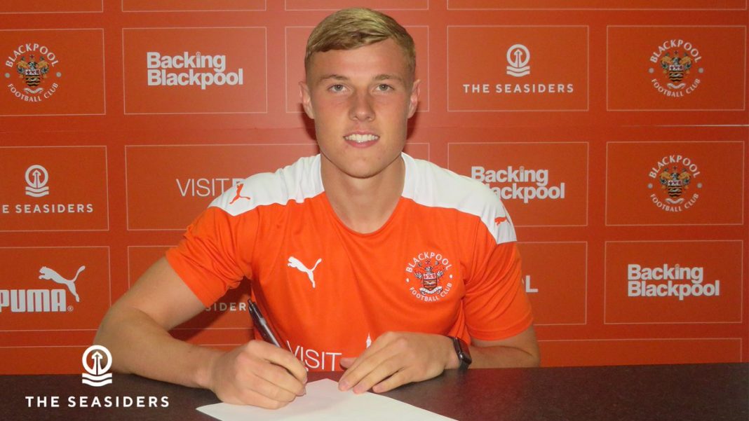 Daniel Ballard signing for Blackpool (Photo via BlackpoolFC.co.uk)