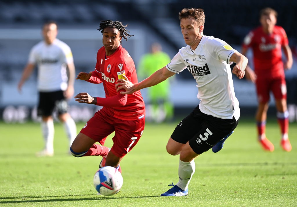 DERBY, ENGLAND - SEPTEMBER 12: Michael Olise of Reading FC and Craig Forsyth of Derby County battle for the ball during the Sky Bet Championship match between Derby County and Reading at Pride Park Stadium on September 12, 2020 in Derby, England. (Photo by Laurence Griffiths/Getty Images)