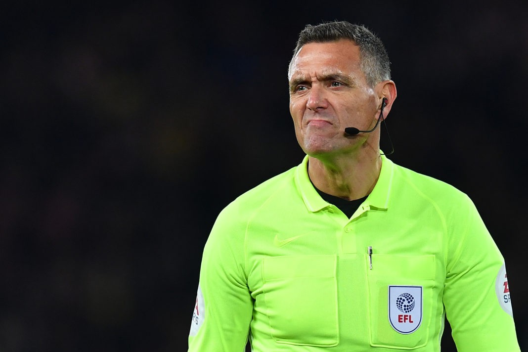 Referee Andre Marriner reacts during the English League Cup fourth round football match between Liverpool and Arsenal at Anfield in Liverpool, north west England on October 30, 2019. (Photo by Paul ELLIS / AFP)