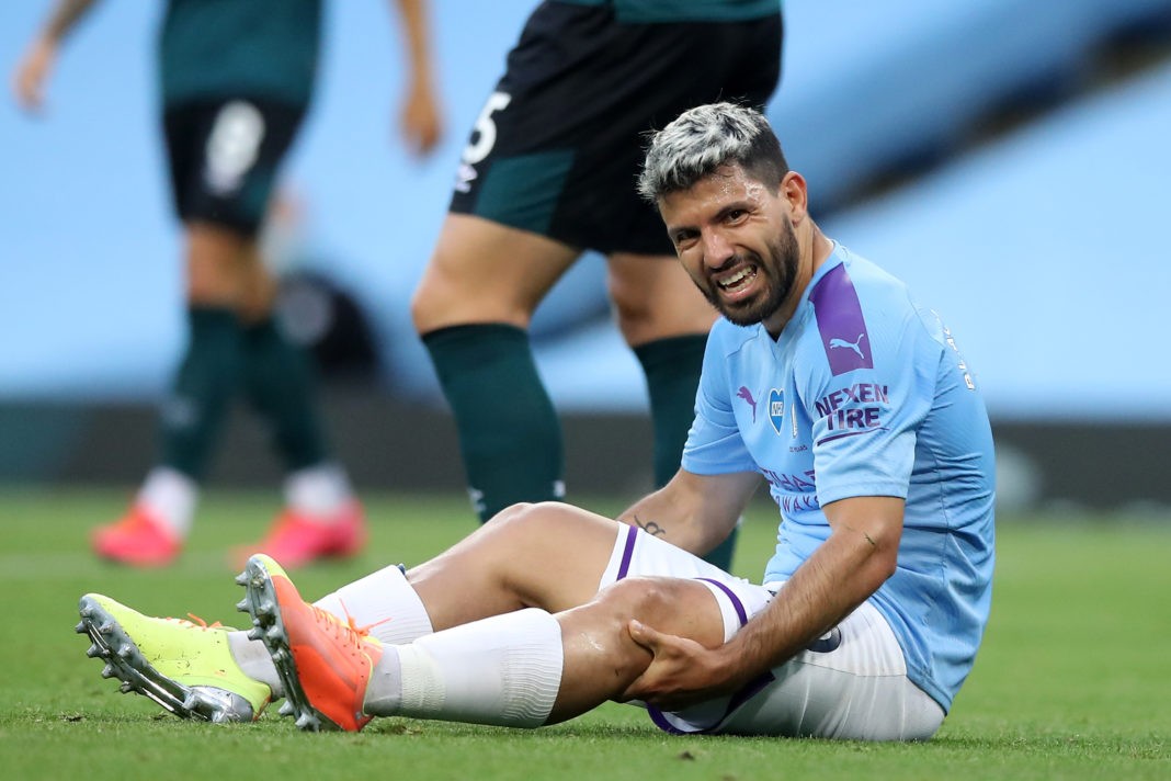 Manchester City's Argentinian striker Sergio Aguero reacts after being injured in a challenge with Burnley's English defender Ben Mee (not pictured) during the English Premier League football match between Manchester City and Burnley at the Etihad Stadium in Manchester, north west England, on June 22, 2020. (Photo by MARTIN RICKETT/POOL/AFP via Getty Images)