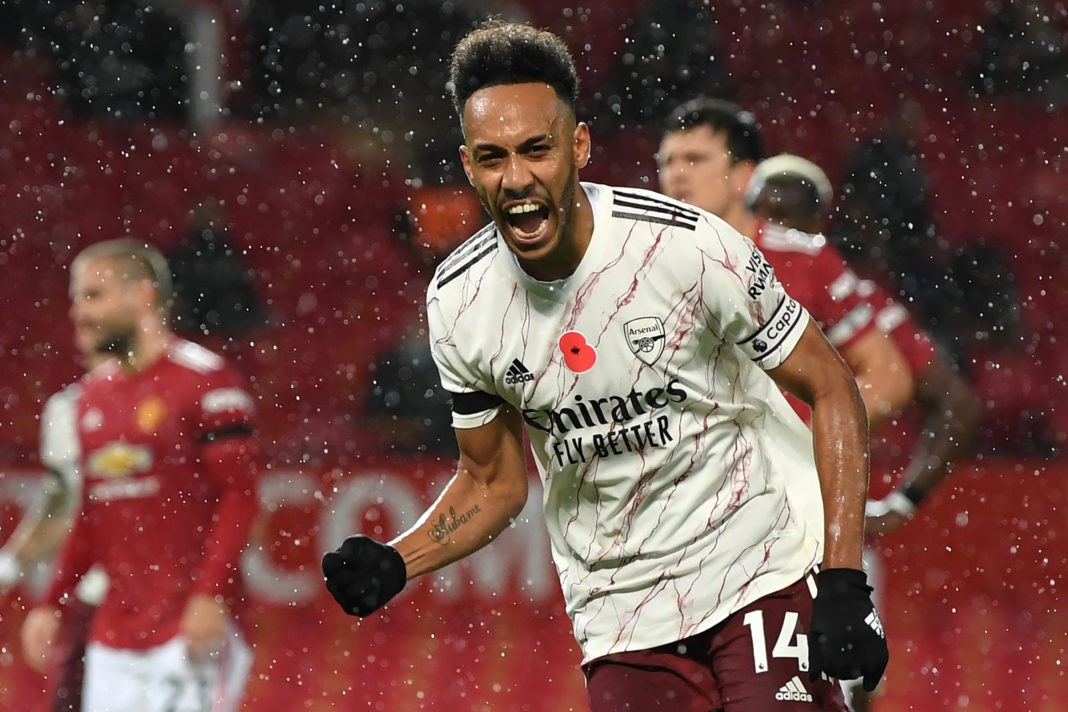 Arsenal's Gabonese striker Pierre-Emerick Aubameyang celebrates after scoring the opening goal from the penalty spot during the English Premier League football match between Manchester United and Arsenal at Old Trafford in Manchester, north west England, on November 1, 2020. (Photo by Shaun Botterill / POOL / AFP)