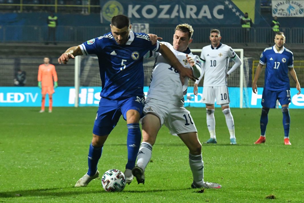 Bosnia and Herzegovina's defender Sead Kolasinac (L) vies with Northern Ireland's forward Kyle Lafferty (R) during the UEFA Euro 2020 Play-off Semi-Final football match between Bosnia and Herzegovina and Northern Ireland in Sarajevo on October 8, 2020. (Photo by ELVIS BARUKCIC/AFP via Getty Images)