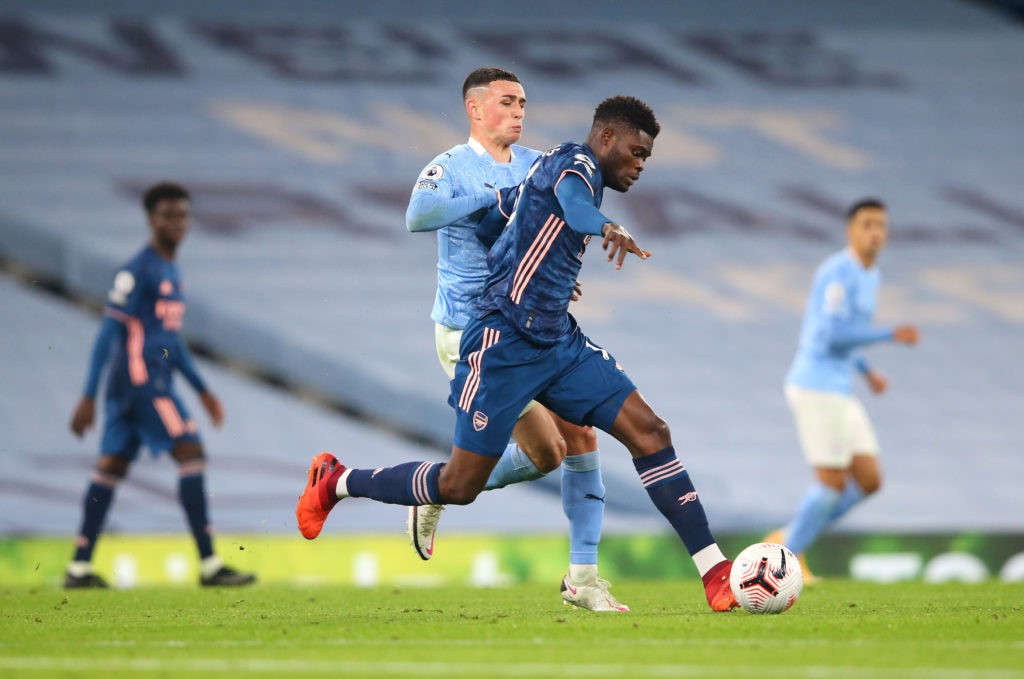 MANCHESTER, ENGLAND: Thomas Partey of Arsenal battles for possession with Phil Foden of Manchester City during the Premier League match between Manchester City and Arsenal at Etihad Stadium on October 17, 2020. (Photo by Alex Livesey/Getty Images)