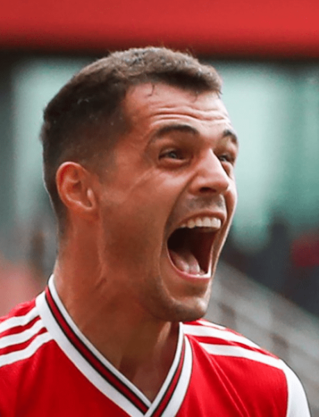 Arsenal's Swiss midfielder Granit Xhaka celebrates after scoring a goal during the English Premier League football match between Arsenal and Norwich City at the Emirates Stadium in London on July 1, 2020. (Photo by MIKE EGERTON / POOL / AFP)