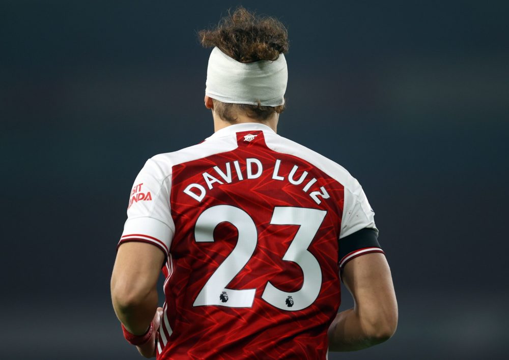 Arsenal's Brazilian defender David Luiz is seen with his head bandaged during the English Premier League football match between Arsenal and Wolverhampton Wanderers at the Emirates Stadium in London on November 29, 2020. (Photo by Julian Finney / POOL / AFP)