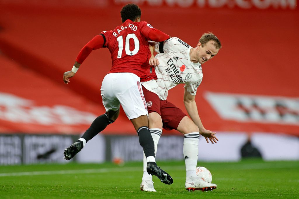 Manchester United's English striker Marcus Rashford (L) vies with Arsenal's English defender Rob Holding (R) on November 1, 2020. (Photo by PHIL NOBLE/POOL/AFP via Getty Images)