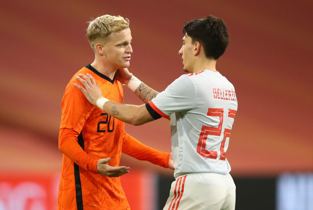 Netherlands' midfielder Donny Van de Beek (L) talks with Spain's defender Hector Bellerin at the end of the friendly football match between Netherlands and Spain at the Johan Cruijff ArenA in Amsterdam on November 11, 2020. (Photo by DEAN MOUHTAROPOULOS/POOL/AFP via Getty Images)